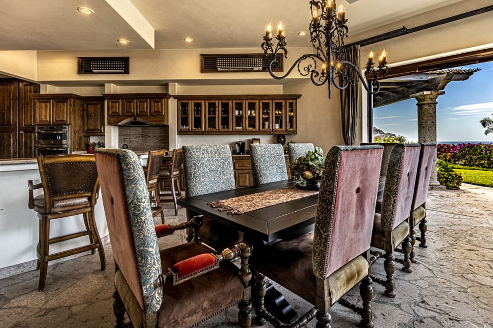 Kitchen island & dining table seating w/pocket doors offer indoor-outdoor living