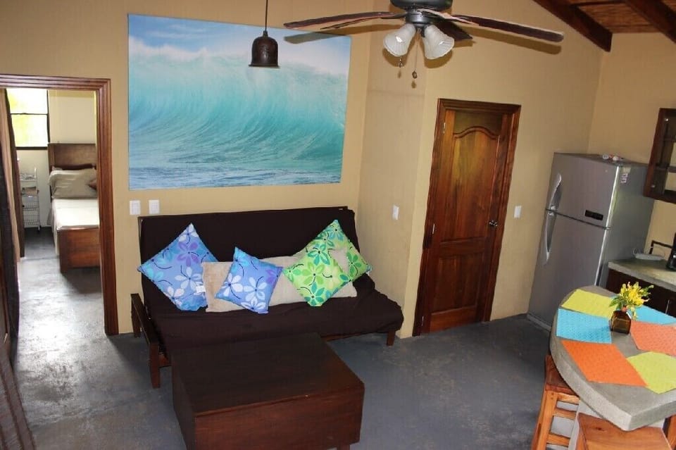 2 Queen size futon couches, and Open concept Dining/ Kitchen/ Living. 