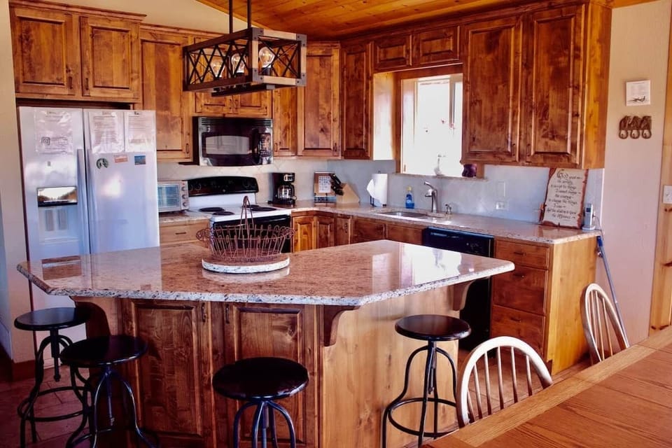 The kitchen island allows for extra seating when entertaining. 