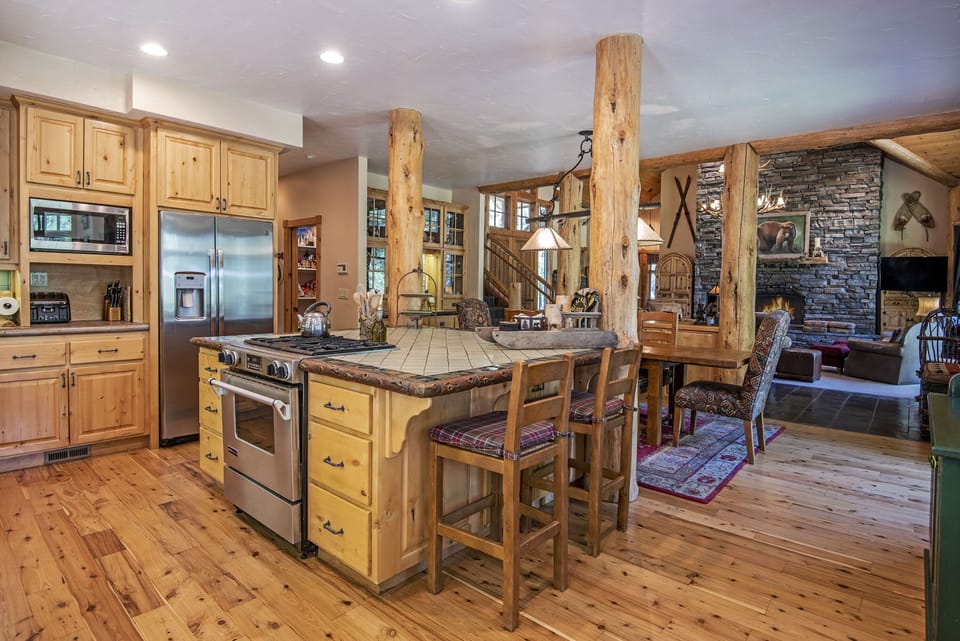A full array of cooking utensils, spices, pots, pans and two coffee makers await