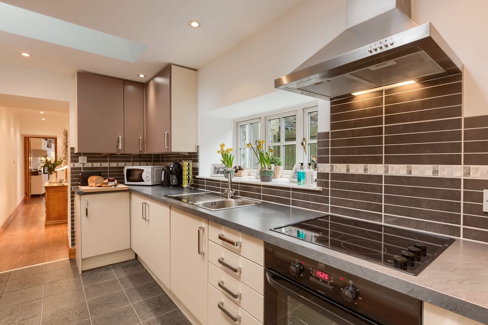 Galley kitchen with all mod cons, including coffee machine