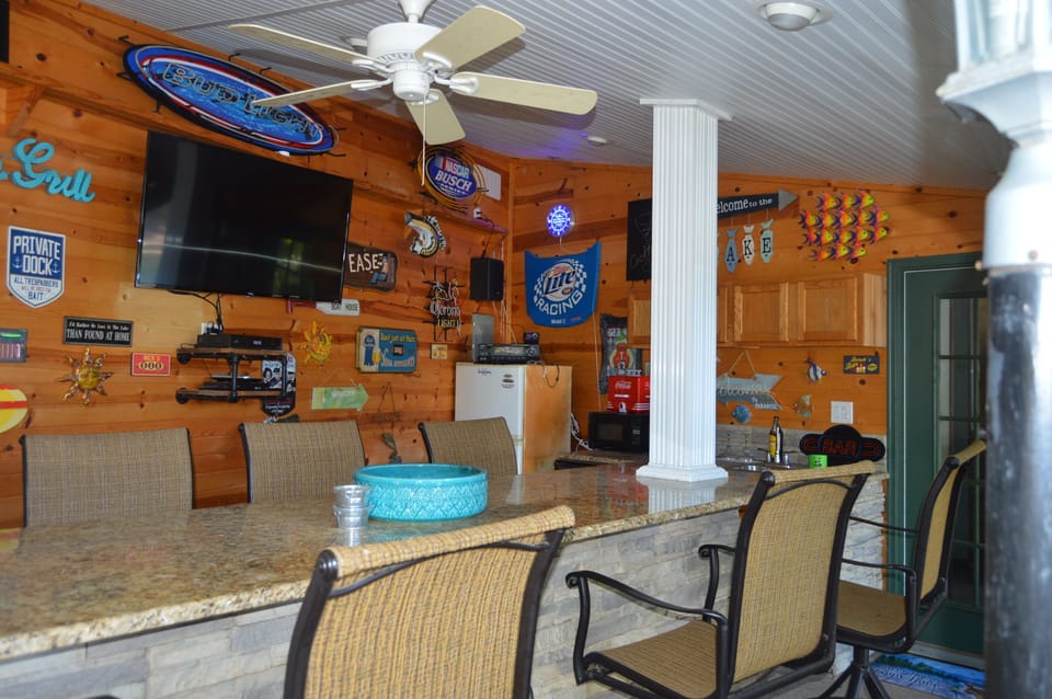 Outdoor bar next to gameroom, bath, fire pit & large deck with plenty of seating