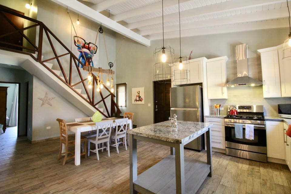 vaulted dining space stairs lead to 3rd bedroom retreat
