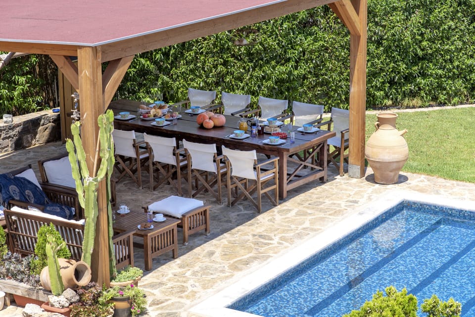 BBQ and dining area next to pool