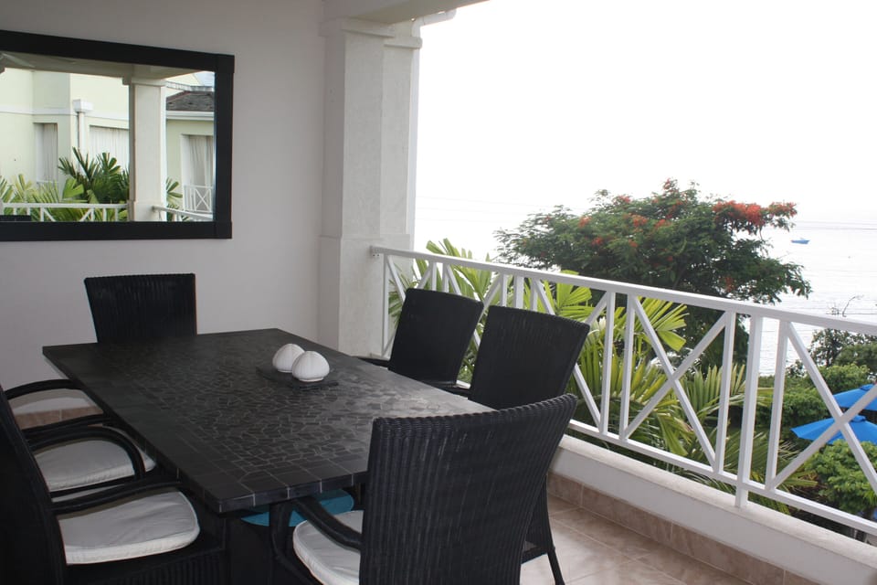 Spacious balcony with expansive Sea Views across Paynes Bay Beach and Pool