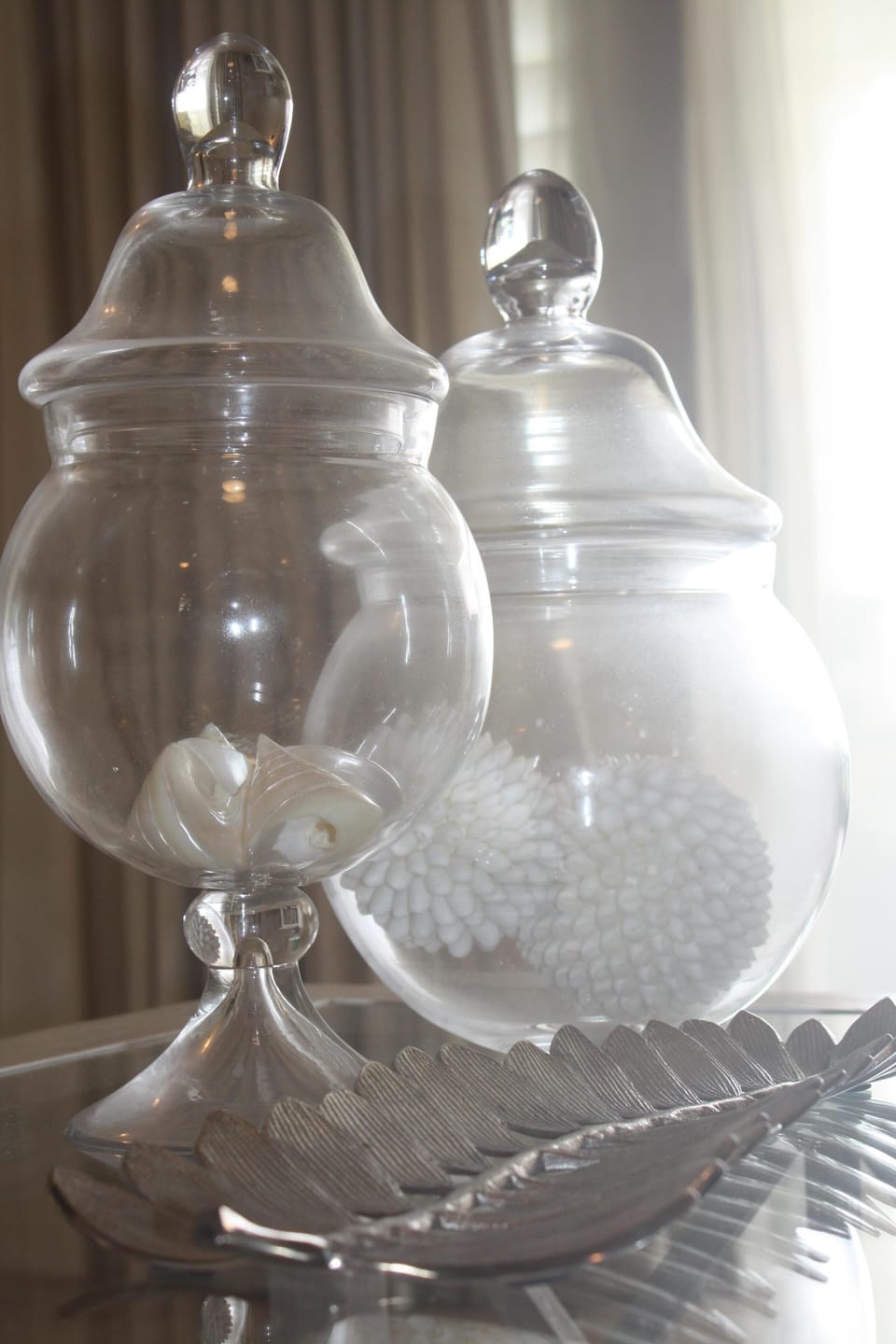 Beautiful interiors themed in soft white, coral & shells, nautical throughout