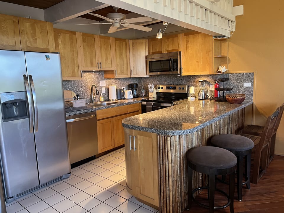 Fully stocked Kitchen area and bar.