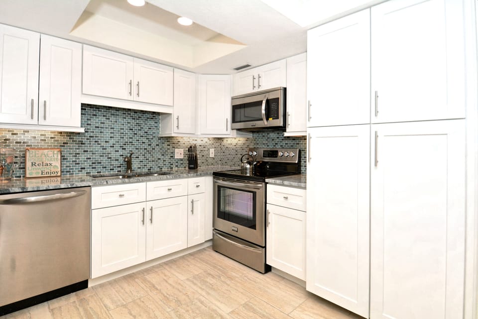 Kitchen is stocked with everything that you need with large double pantry.