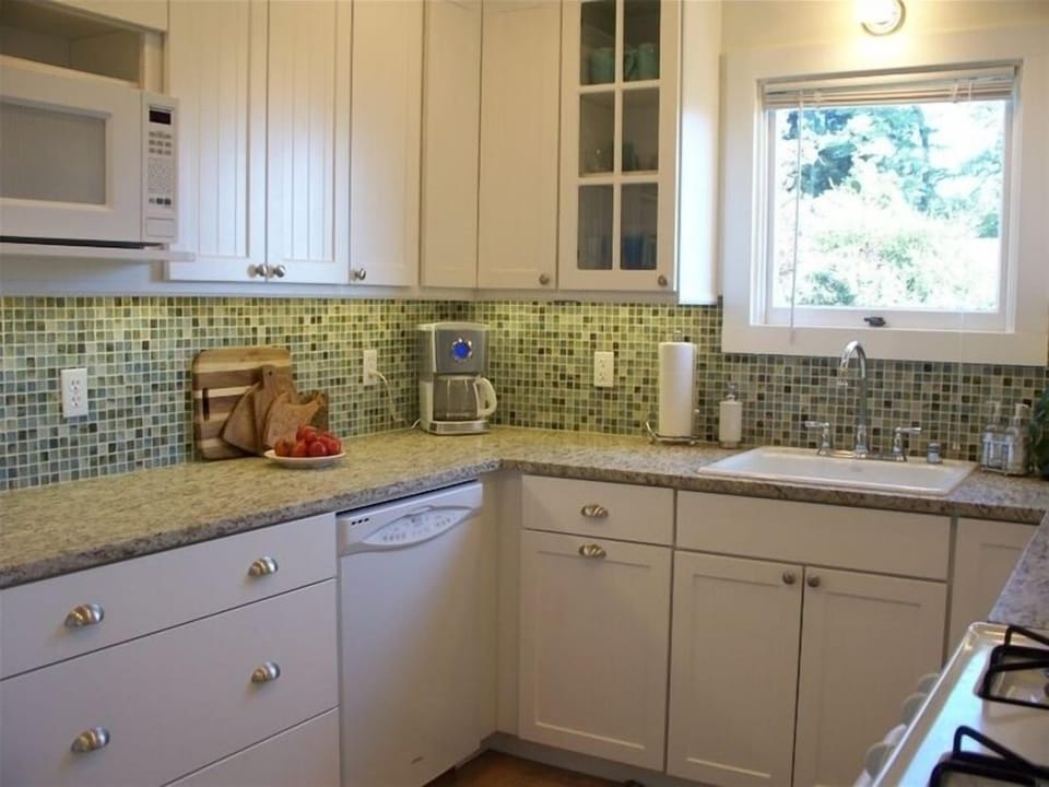 Kitchen area, with recycled glass tiles