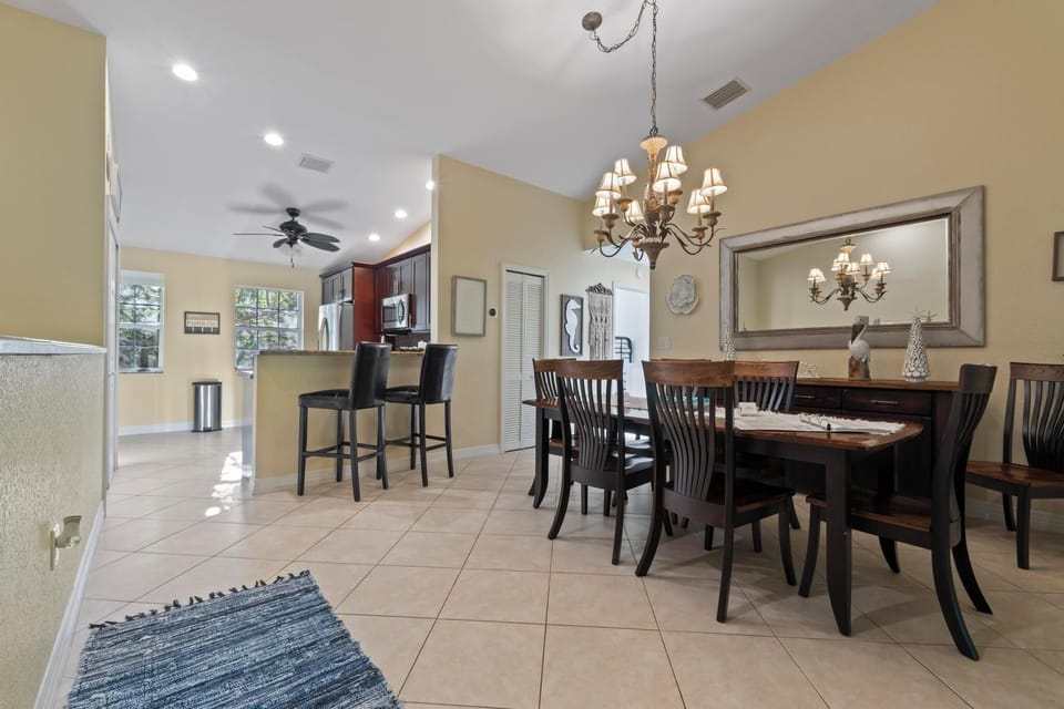 The dining table has sitting for 8, plus 2 bar stools. 