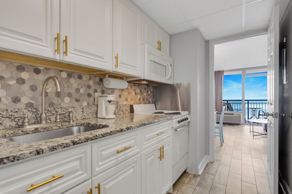 Cook up a storm in our fully equipped kitchen with ocean vistas!