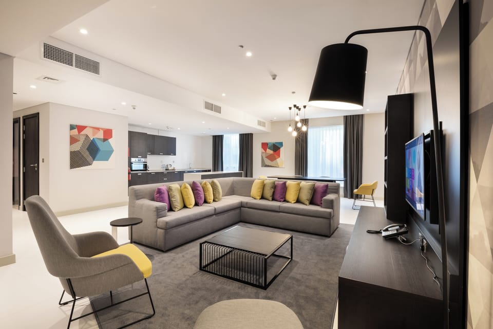 Apartment, 3 Bedrooms (Urban) | Living area | 43-inch LED TV with cable channels