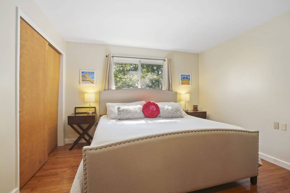 Master bedroom features a king-sized bed with a luxurious memory foam mattress