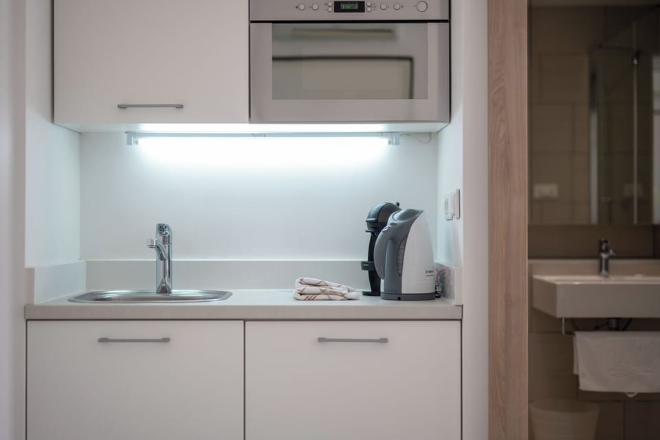 Classic Double Room, Balcony | Private kitchen | Coffee/tea maker, electric kettle, cleaning supplies