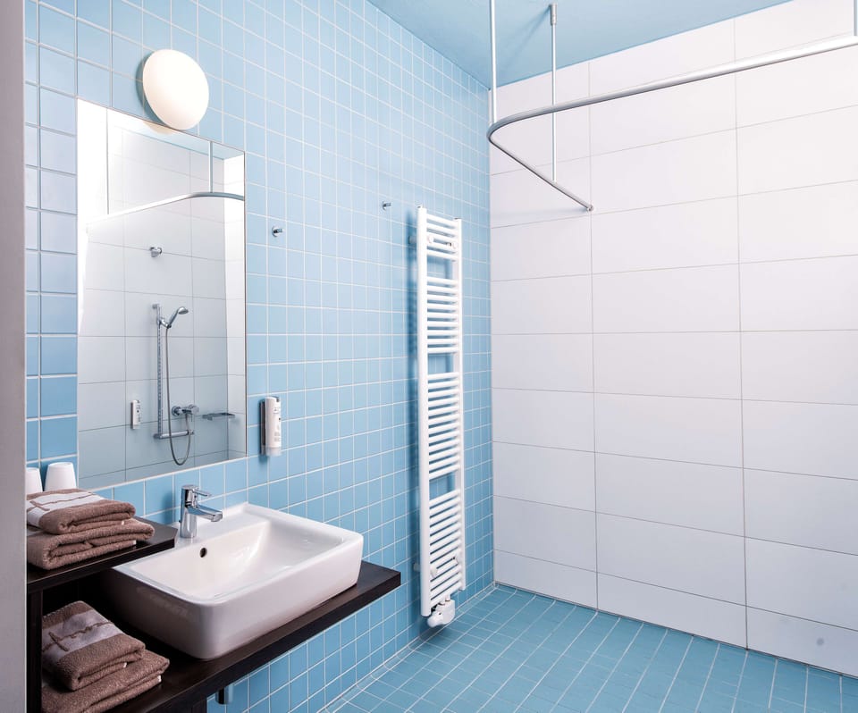Apartment, 2 Bedrooms | Bathroom amenities | Shower, hair dryer, slippers, towels