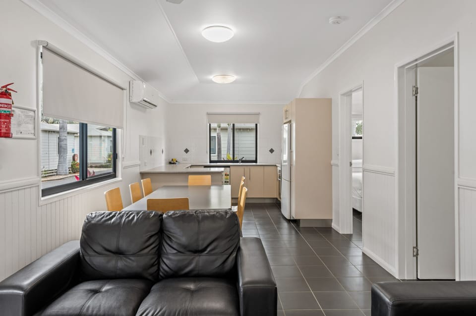 Deluxe 3 Bedroom Cabin - Sleeps 8 | Living area | 32-inch flat-screen TV with cable channels, TV