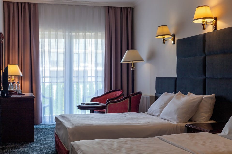 Triple Room | In-room safe, desk, laptop workspace, blackout drapes