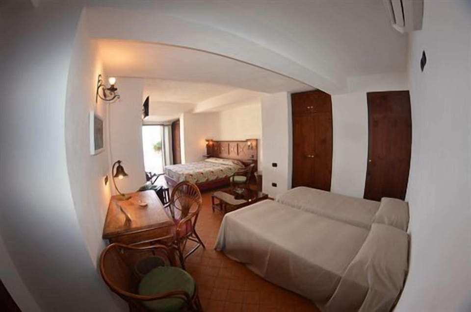 Standard Quadruple Room | Minibar, in-room safe, desk, cribs/infant beds