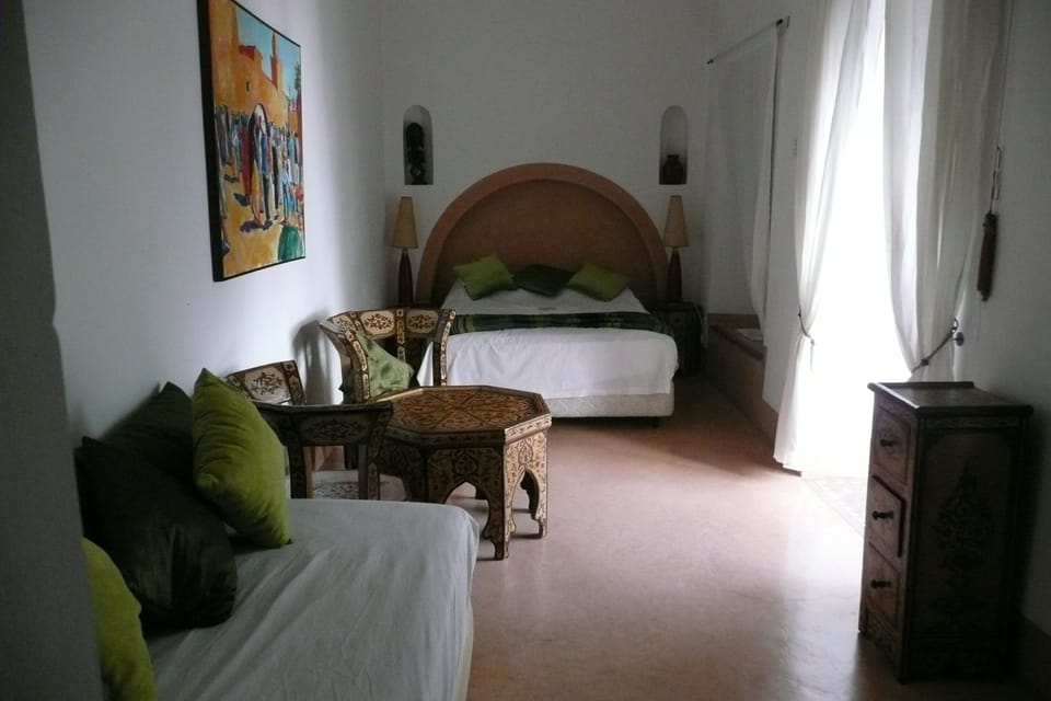 Suite | Premium bedding, individually decorated, blackout drapes