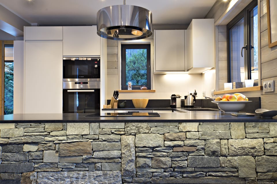 Granite breakfast bar reclaimed from original house before renovation
