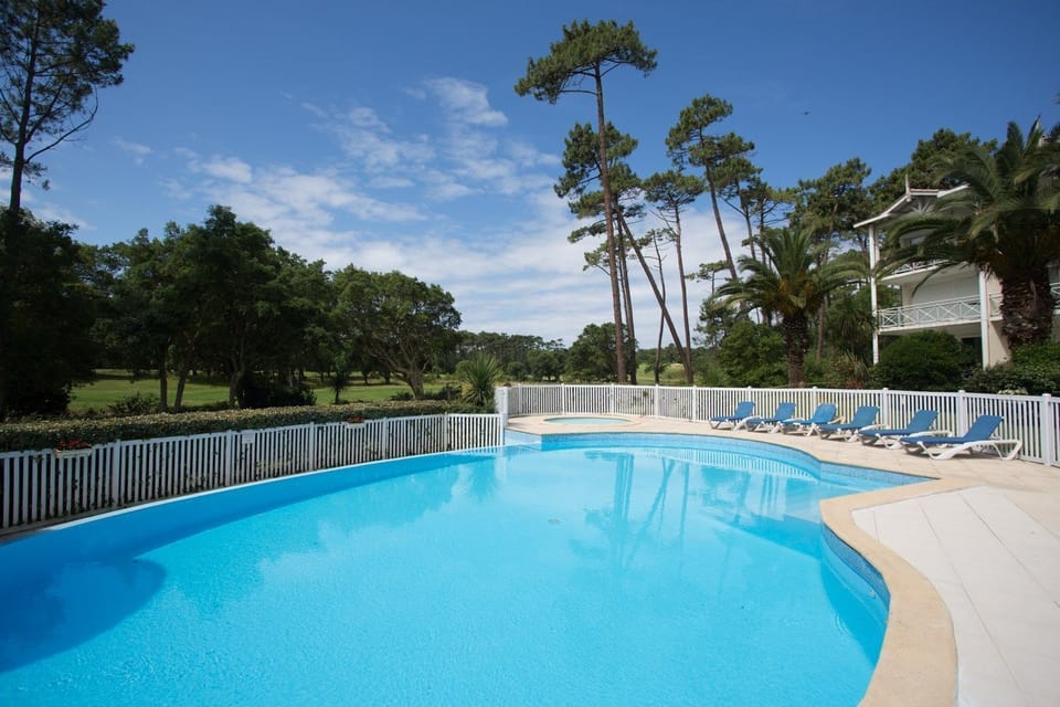 Take a quick dip in the shared seasonal pool.