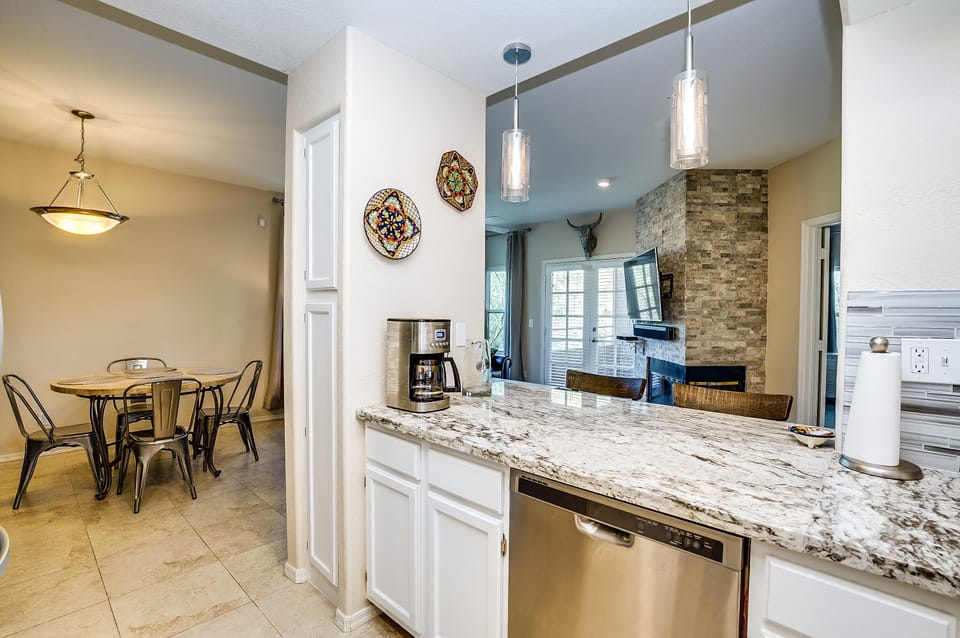 Dining area includes mountain views, warm dimmable lighting