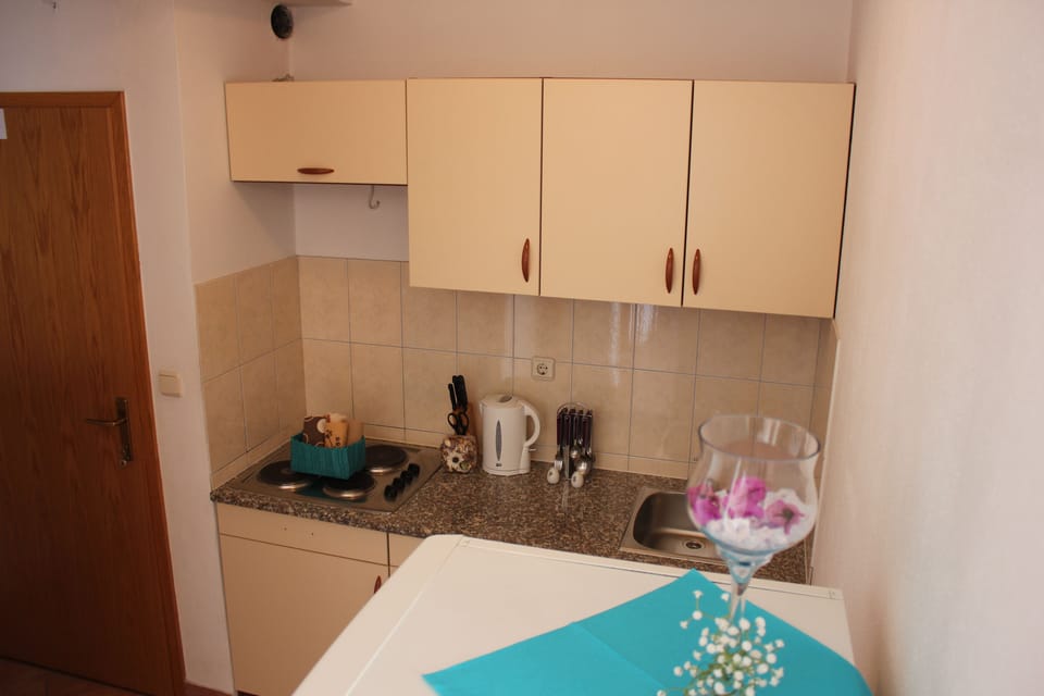 Apartment, Sea View | Private kitchen | Fridge, microwave, stovetop, electric kettle