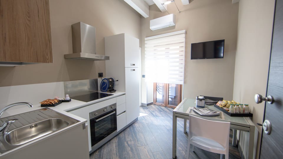 Deluxe Apartment | Private kitchen | Full-size fridge, oven, stovetop, espresso maker