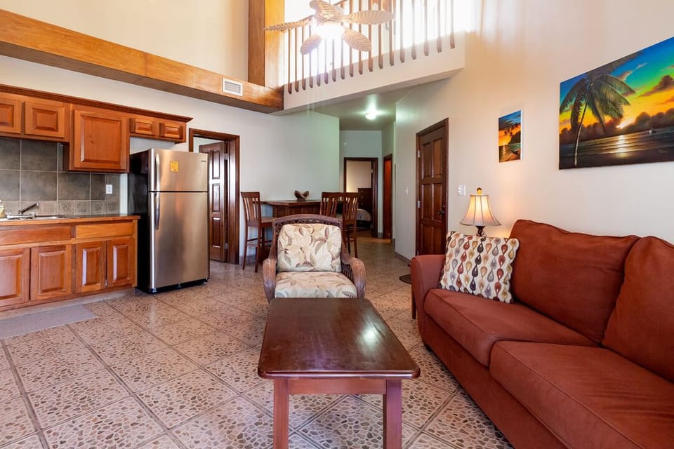 Lofted living, dining and kitchen area