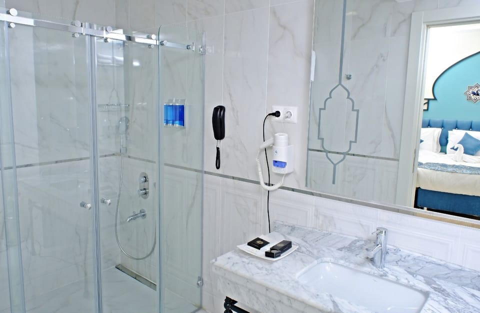 Shower, free toiletries, hair dryer, slippers