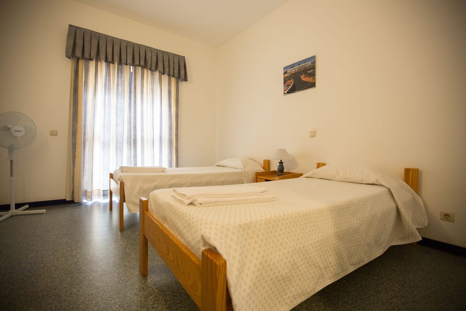 Twin Room, Private Bathroom | Blackout drapes, free WiFi, bed sheets