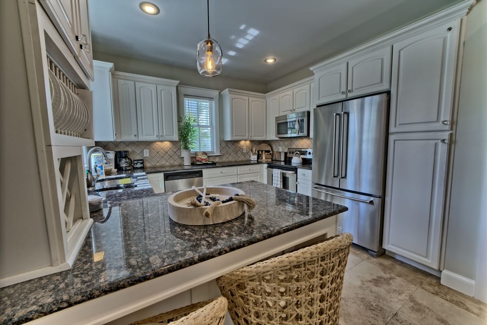 Open fully stocked kitchen counter seating for two with courtyard view 