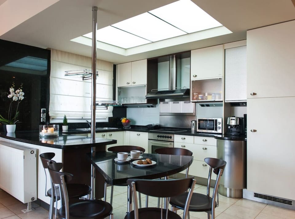 Fully equipped kitchen with modern appliances, cookware, and essentials, ideal for guests who enjoy home-cooked meals.