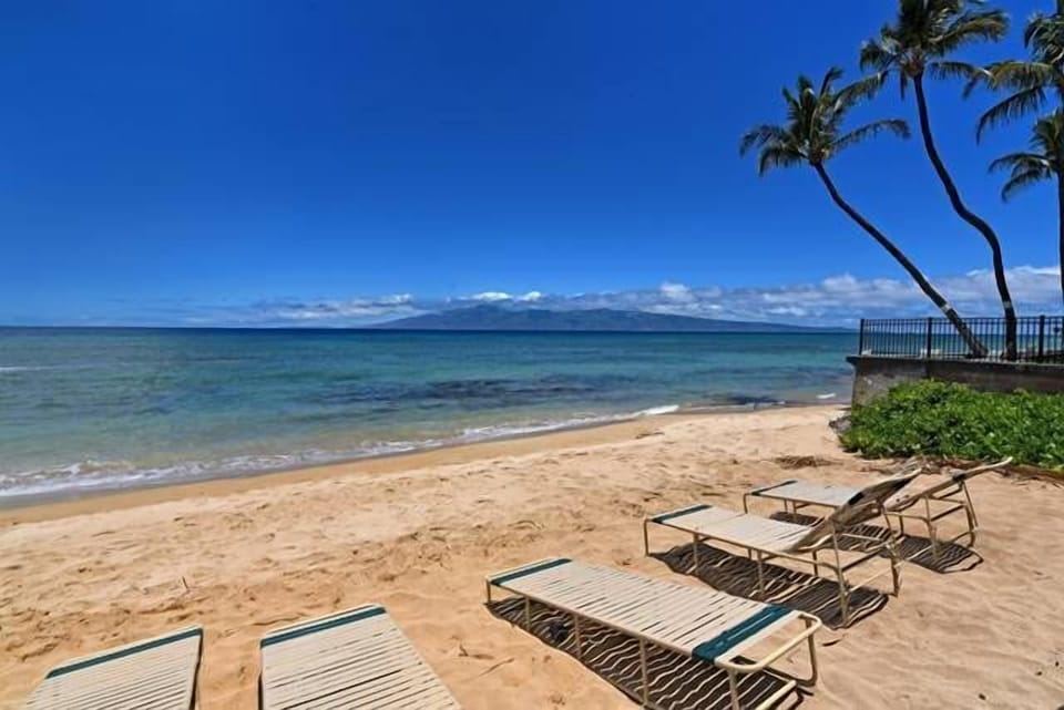 Direct access to white sandy beach.