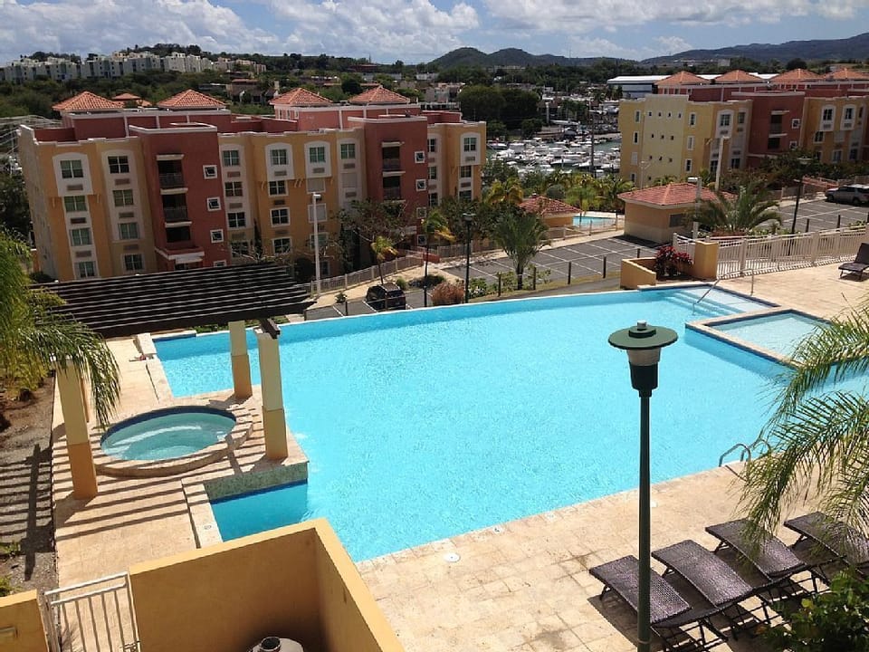 Infinity Pool with Gazebo and Round Spa (non-heated) water stream flow.