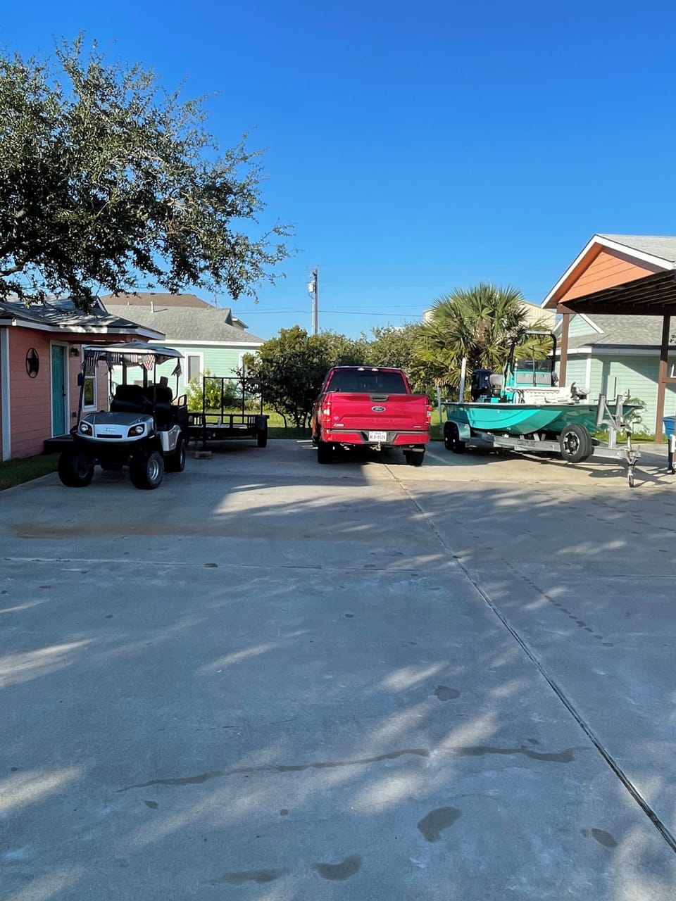 Parking for boat and vehicles between carport and Bunker.
