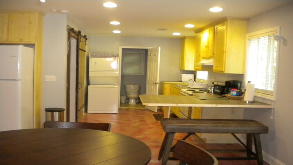 Kitchen with seating bench for dining.
