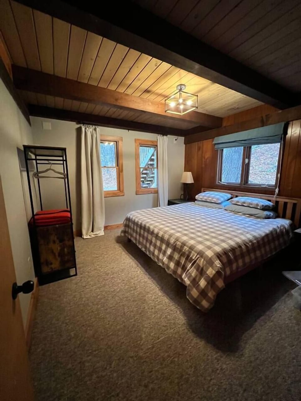 Main bedroom with king bed and plentiful windows for a nice breeze for cool sleeping or keep them shut and use the A/C