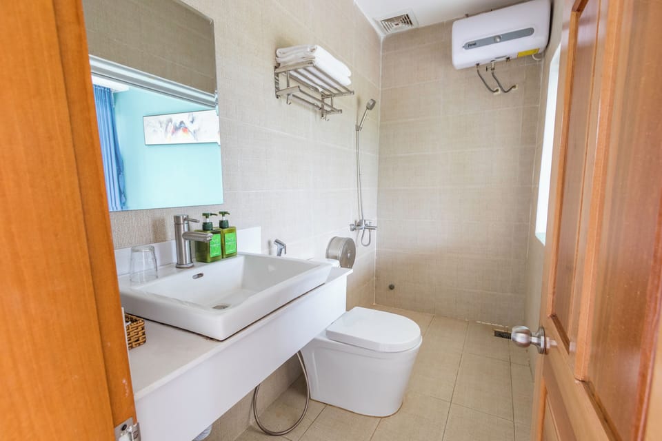 Family Quadruple Room, 2 Queen Beds, Balcony, Garden View | Bathroom | Shower, free toiletries, hair dryer, slippers