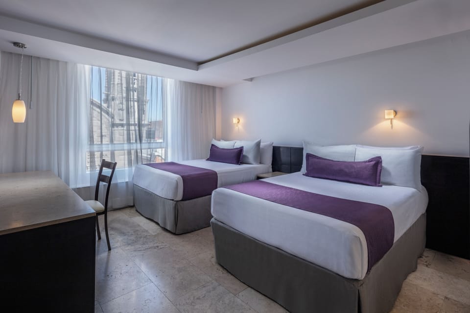 Deluxe Room, 2 Double Beds | In-room safe, desk, iron/ironing board, cribs (free)