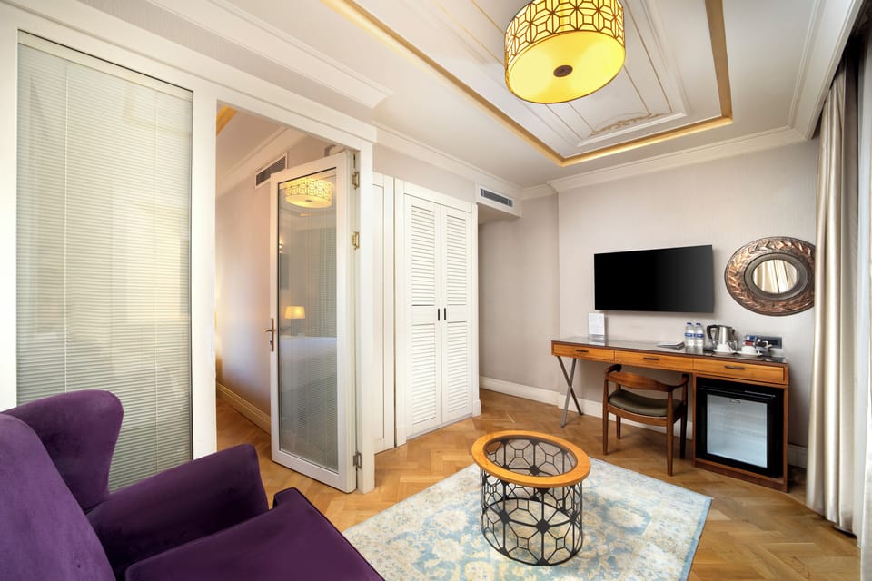 Junior Suite, 1 Bedroom | Living area | 42-inch LED TV with satellite channels, TV