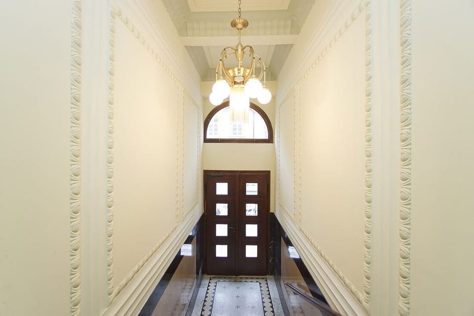 Hallway to front door of building.