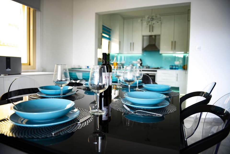 Dining table with kitchen beyond