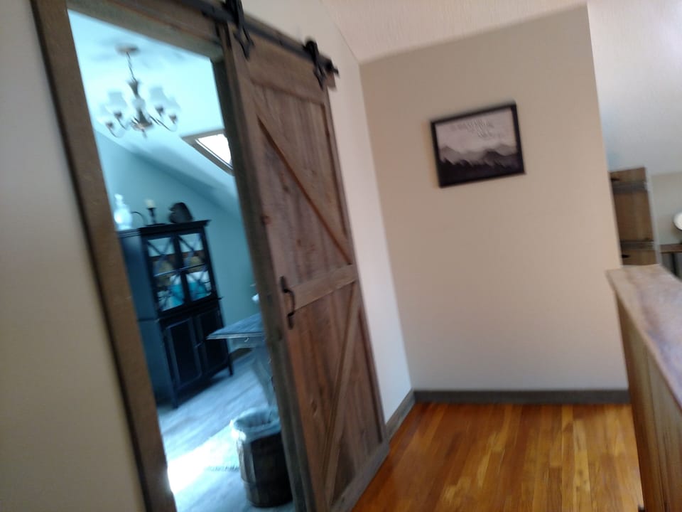 Custom made barndoor entry into master bathroom