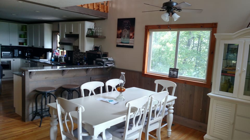 large dining table and bar seating easily accommodates large families