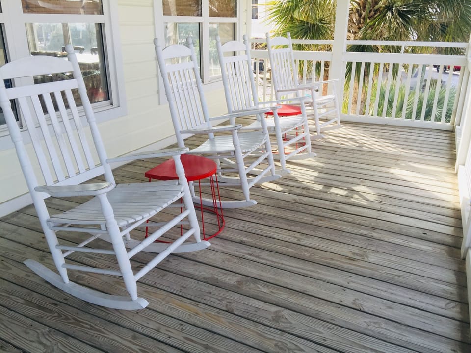 Large space with rocking chairs and a porch swing to enjoy as you enter 