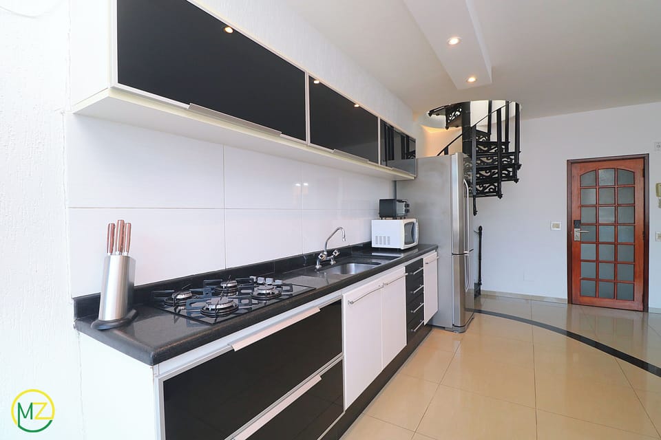 Penthouse, Multiple Beds, Non Smoking | Private kitchen | Full-size fridge, microwave, oven, stovetop