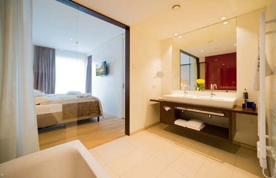 Suite | Bathroom | Hair dryer, bathrobes, towels