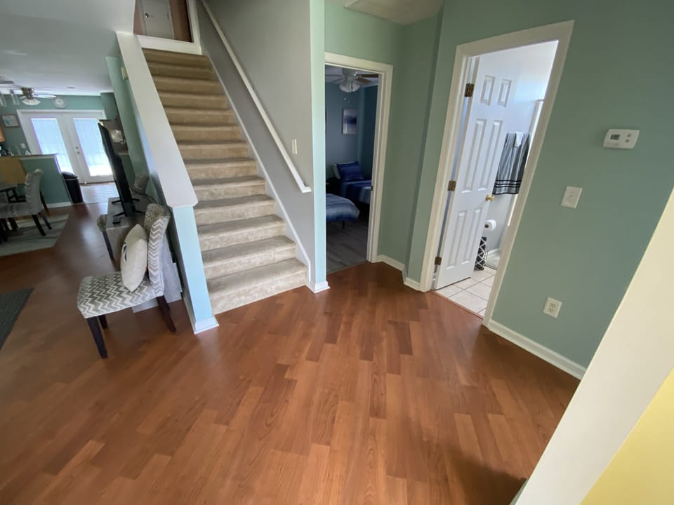 Living room connects to Blue and yellow room With the shared Bathroom