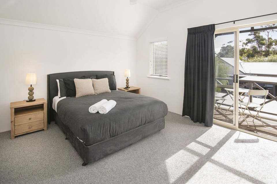 The spacious master bedroom  features an ensuite and private balcony.